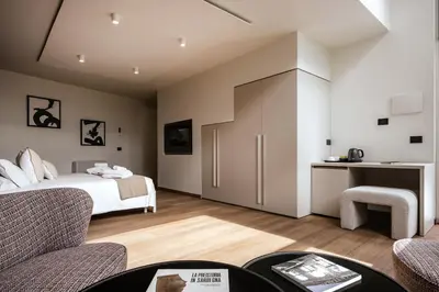 Letto o letti in una camera di RH Lifestyle Rooms & Suites