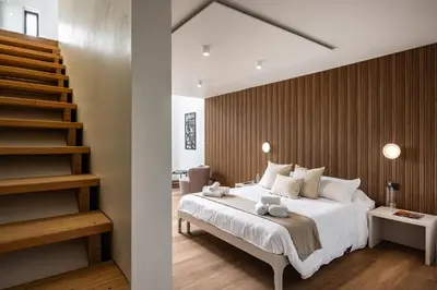 Letto o letti in una camera di RH Lifestyle Rooms & Suites