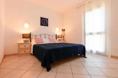 Letto o letti in una camera di Residence SardegnaSummer Li Cuppulati