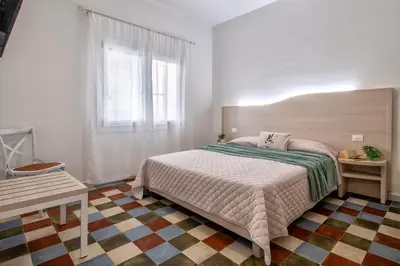 Letto o letti in una camera di Casa Rosmarino