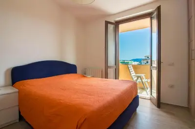 Letto o letti in una camera di GuestHost - Olbia Oasis Apartment W Two Balconies!