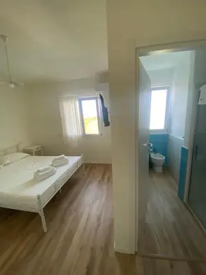 Letto o letti in una camera di Luscofusco