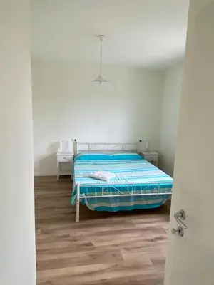 Letto o letti in una camera di Luscofusco