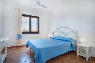 Letto o letti in una camera di AMBRA Holiday Rooms - Porto San Paolo