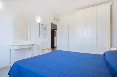 Letto o letti in una camera di AMBRA Holiday Rooms - Porto San Paolo