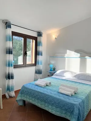 Letto o letti in una camera di Appartamenti Sa Codula IUN R8525
