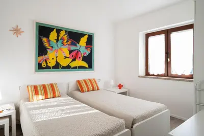 Letto o letti in una camera di Casa Cindy