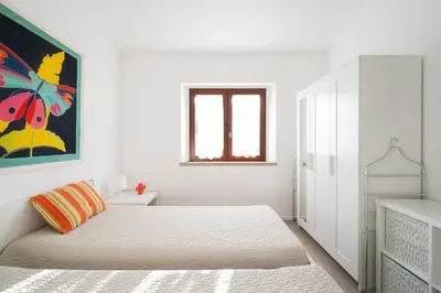 Letto o letti in una camera di Casa Cindy