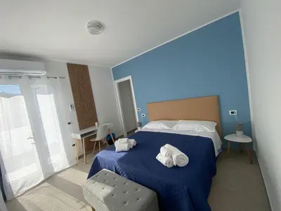 Letto o letti in una camera di DOMO DE MARIA