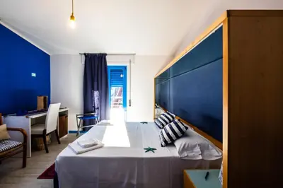 Letto o letti in una camera di La Favorita Hotel
