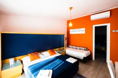 Letto o letti in una camera di La Favorita Hotel