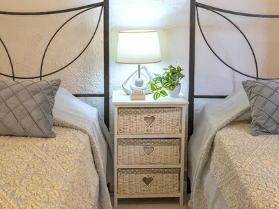 Letto o letti in una camera di Apartment D4 - I1- Baia de Bahas by Interhome