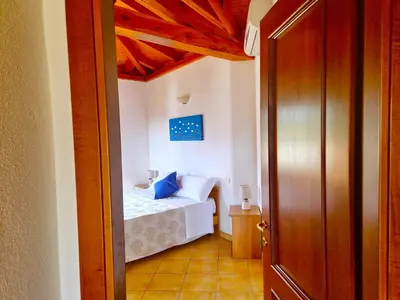Letto o letti in una camera di Mikè House- Appartamento con balcone a Sos Alinos