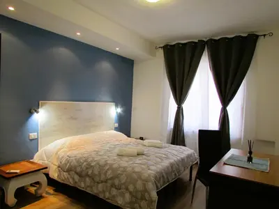 Letto o letti in una camera di Casa Ribes Rooms, l'angolo tranquillo alle porte della città