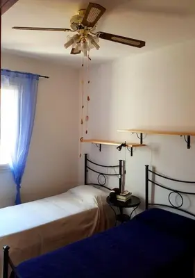 Letto o letti in una camera di Rilassarsi a Orosei