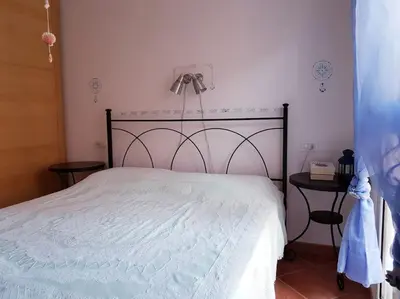 Letto o letti in una camera di Rilassarsi a Orosei