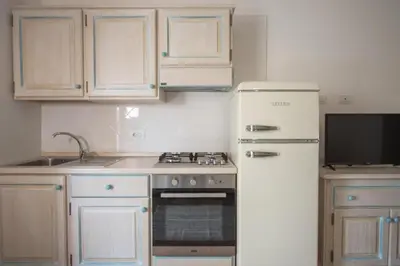 Cucina o angolo cottura di Superb Le Residenze del Golfo di Orosei 1 Bedroom apartment for 4 people