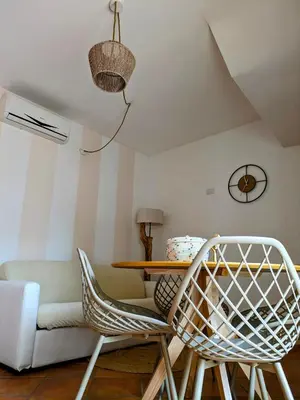 Area soggiorno di Olivastro Apartment Murta Maria