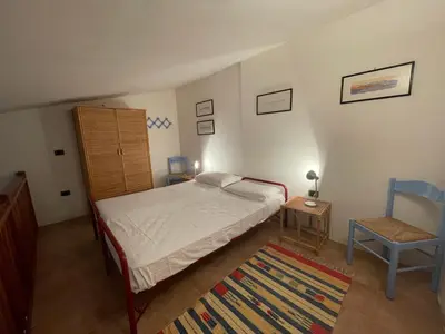 Letto o letti in una camera di Casa Punta Ruinas