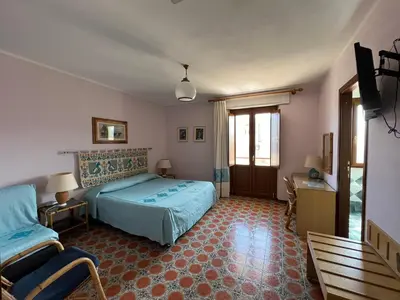Letto o letti in una camera di Hotel L'Oasi