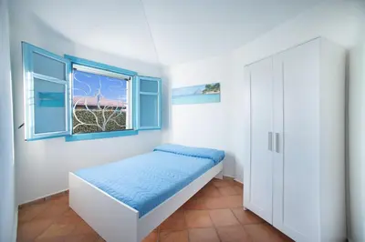 Letto o letti in una camera di Villetta Beach House