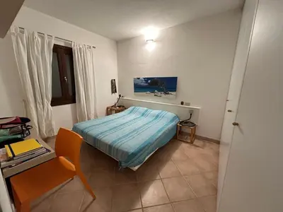 Letto o letti in una camera di Appartamento nel verde con vista su Tavolara