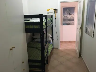 Letto o letti in una camera di Appartamento nel verde con vista su Tavolara