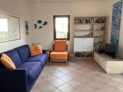 Area soggiorno di Appartamento nel verde con vista su Tavolara