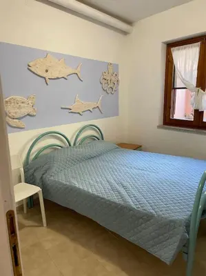 Letto o letti in una camera di L'accogliente Casa Ginepro