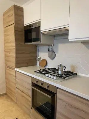 Cucina o angolo cottura di L'accogliente Casa Ginepro
