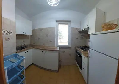 Cucina o angolo cottura di VILLA PIETRAMARINA CALA LIBEROTTO appartamento 4 posti