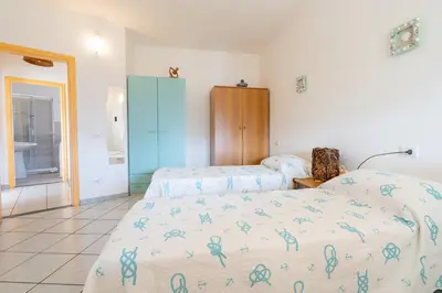 Letto o letti in una camera di Casa Rockefeller