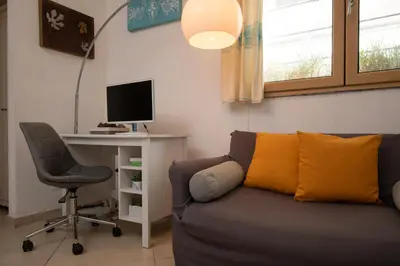 TV o dispositivi per l'intrattenimento presso Iknos Suites by Wonderful Italy