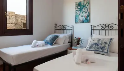 Letto o letti in una camera di Casa EOS