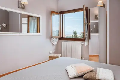 Letto o letti in una camera di OLBIA SKYVIEW ATTIC, Gaia's House