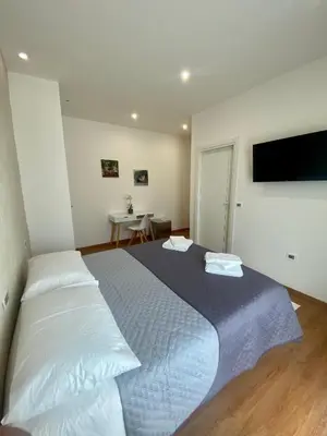 Letto o letti in una camera di Zulie Rooms