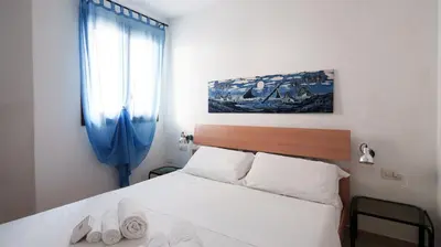 Letto o letti in una camera di Welcomely - Petali di Rosa - A Due Passi dalla Spiaggia