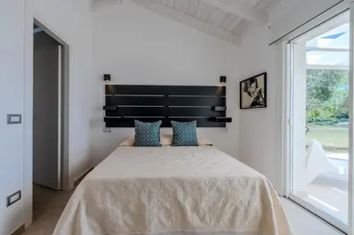 Letto o letti in una camera di Villa DEG Vista Mare San Teodoro Puntaldia