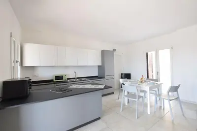 Cucina o angolo cottura di Villa Del Sole In Budoni Sea View