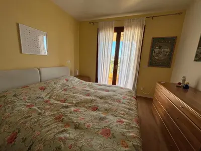 Letto o letti in una camera di Olbia - accogliente casa vicina al centro e spiagge