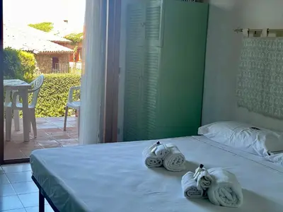 Letto o letti in una camera di PUNTA EST Monolocale Vista Mare