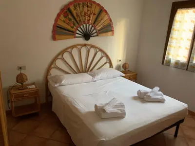 Letto o letti in una camera di Appartamento Stile Gallurese