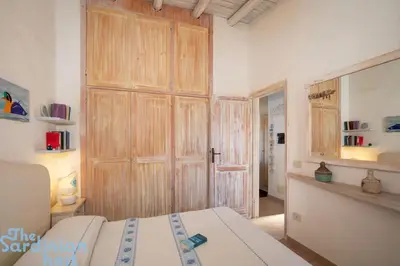 Letto o letti in una camera di Tavolara House-family relax