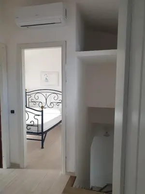 Letto o letti in una camera di Villa Lentischio