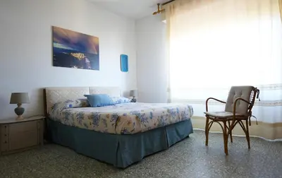 Letto o letti in una camera di Casa Cartolina Santa Lucia