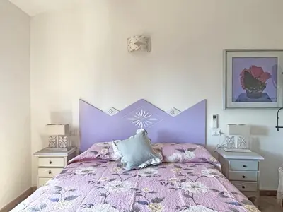 Letto o letti in una camera di Villa del Golfo