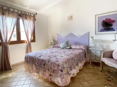 Letto o letti in una camera di Villa del Golfo