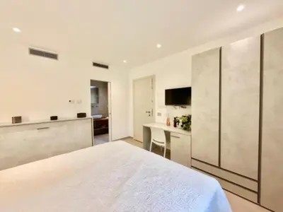 Letto o letti in una camera di Villa Berenike