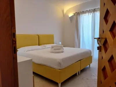 Letto o letti in una camera di Vittoria Home