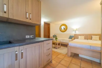 Letto o letti in una camera di Le Giuggiole di Punta Molara